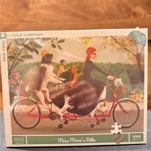 New York Puzzle Company Miss Moon’s Bike 1000 piece Puzzle  *New in box